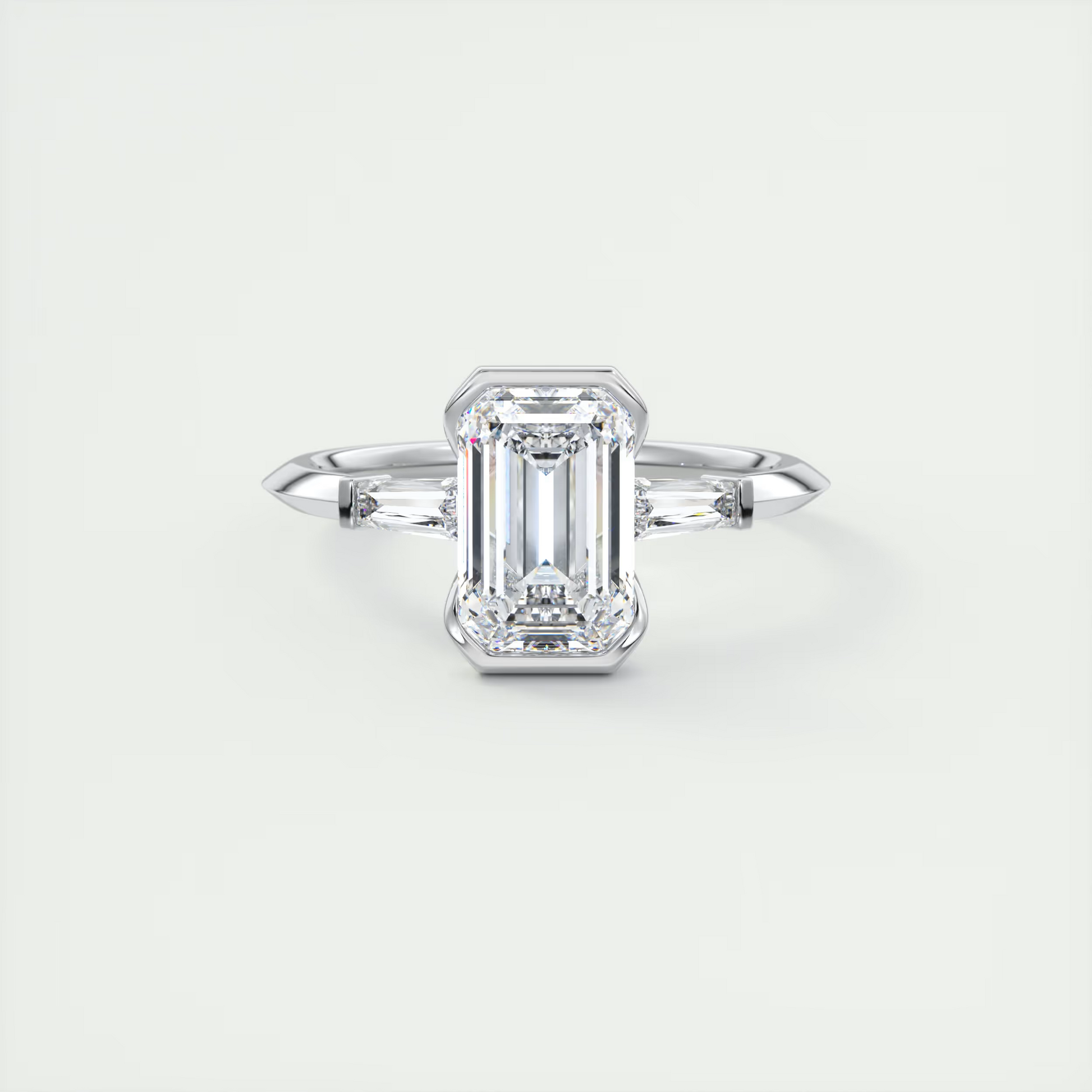 Sharp 2 Carat Emerald Half Bezel Three-Stone Engagement Ring