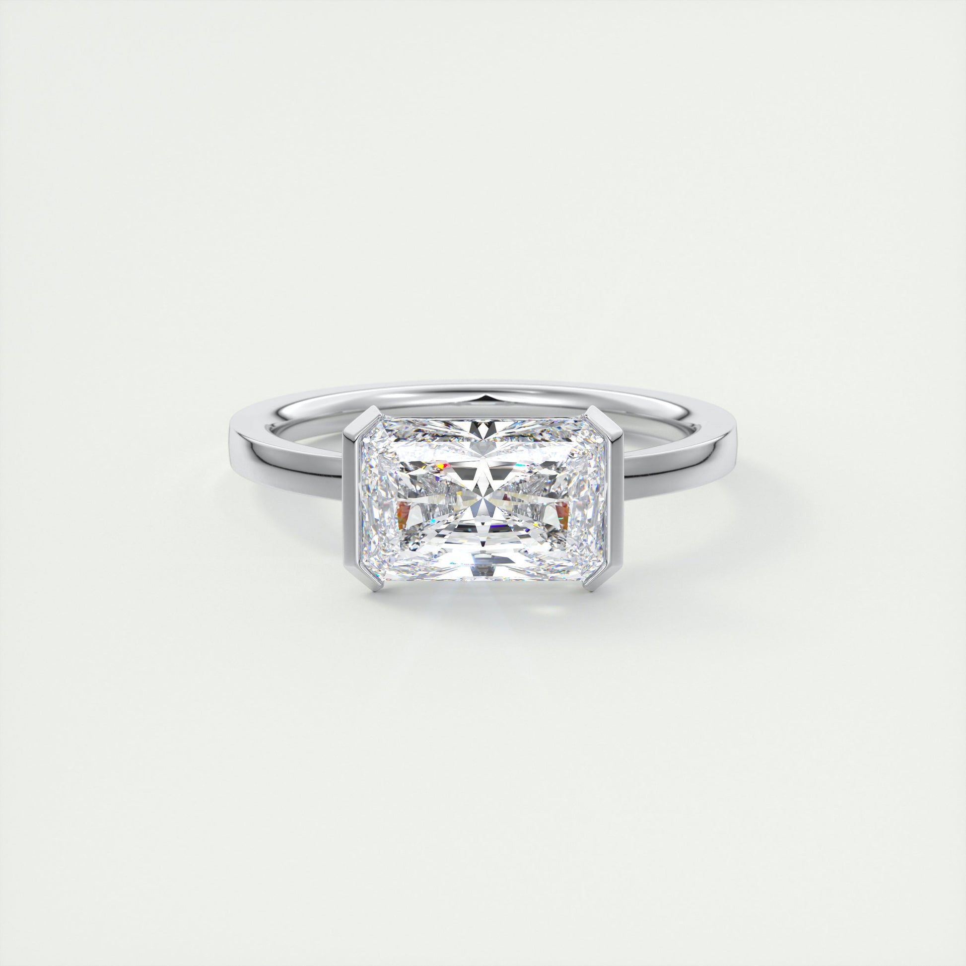 2 Carat East West Radiant Emerald Half Bezel Solitaire