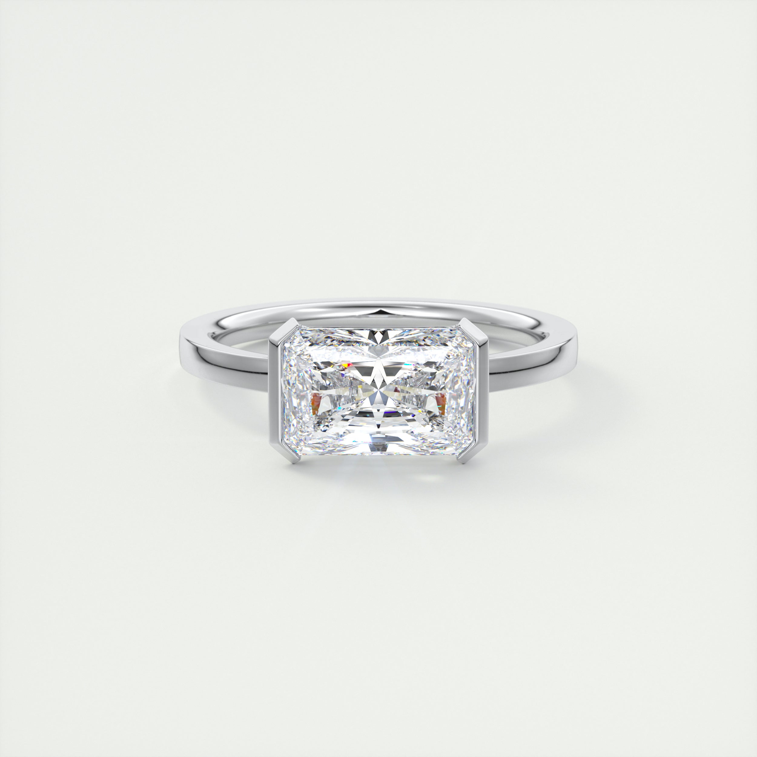 2 Carat East West Radiant Emerald Half Bezel Solitaire