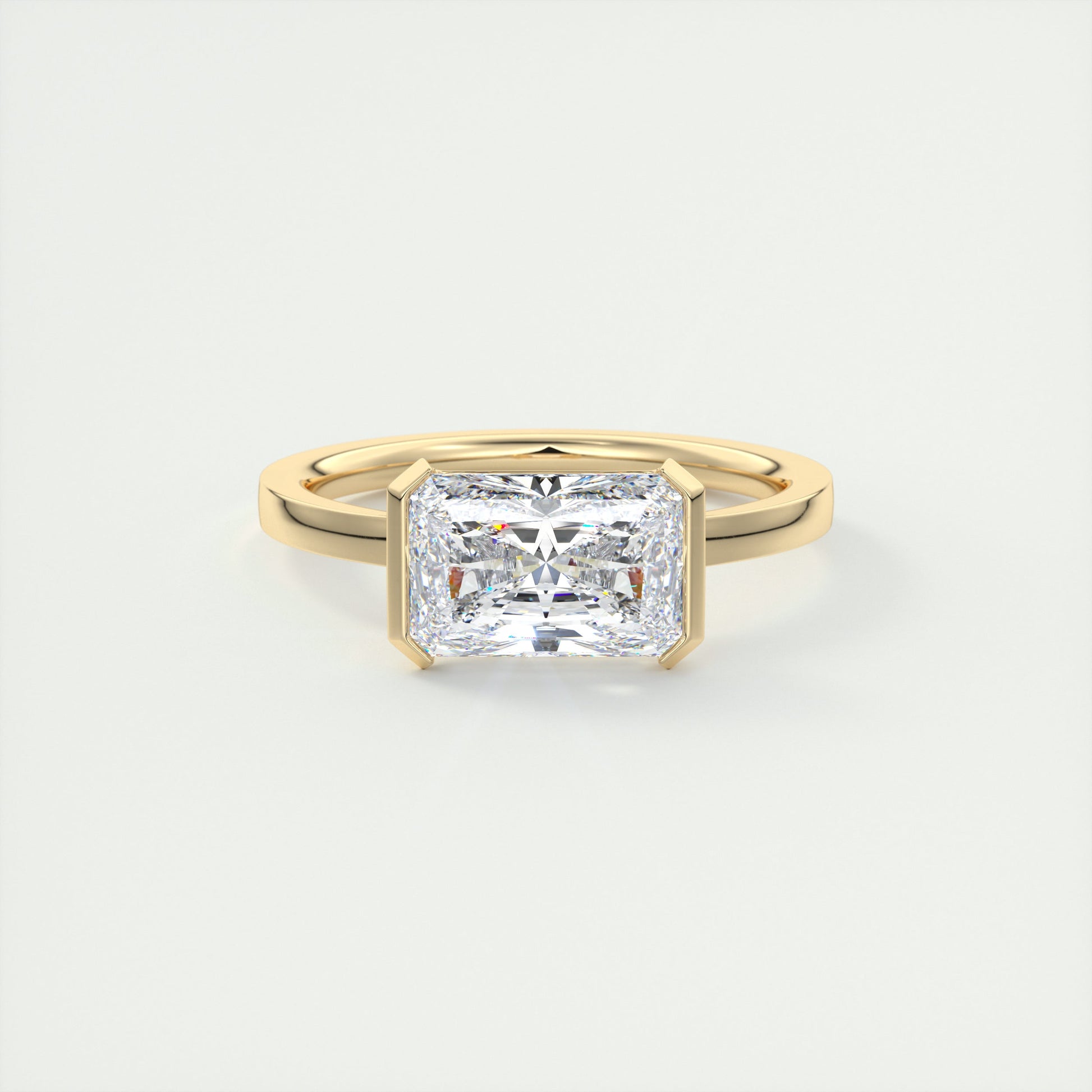 2 Carat East West Radiant Emerald Half Bezel Solitaire