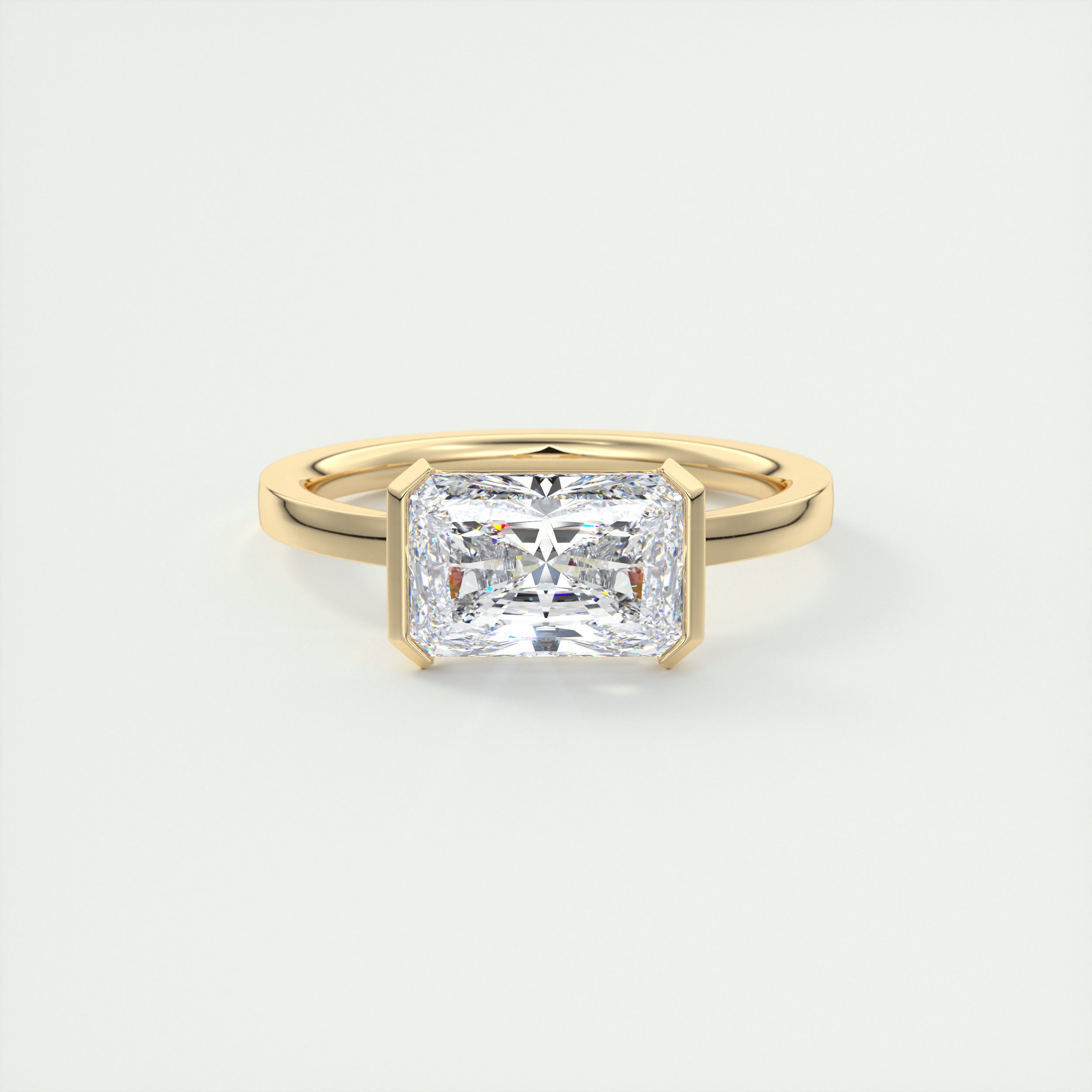 2 Carat East West Radiant Emerald Half Bezel Solitaire