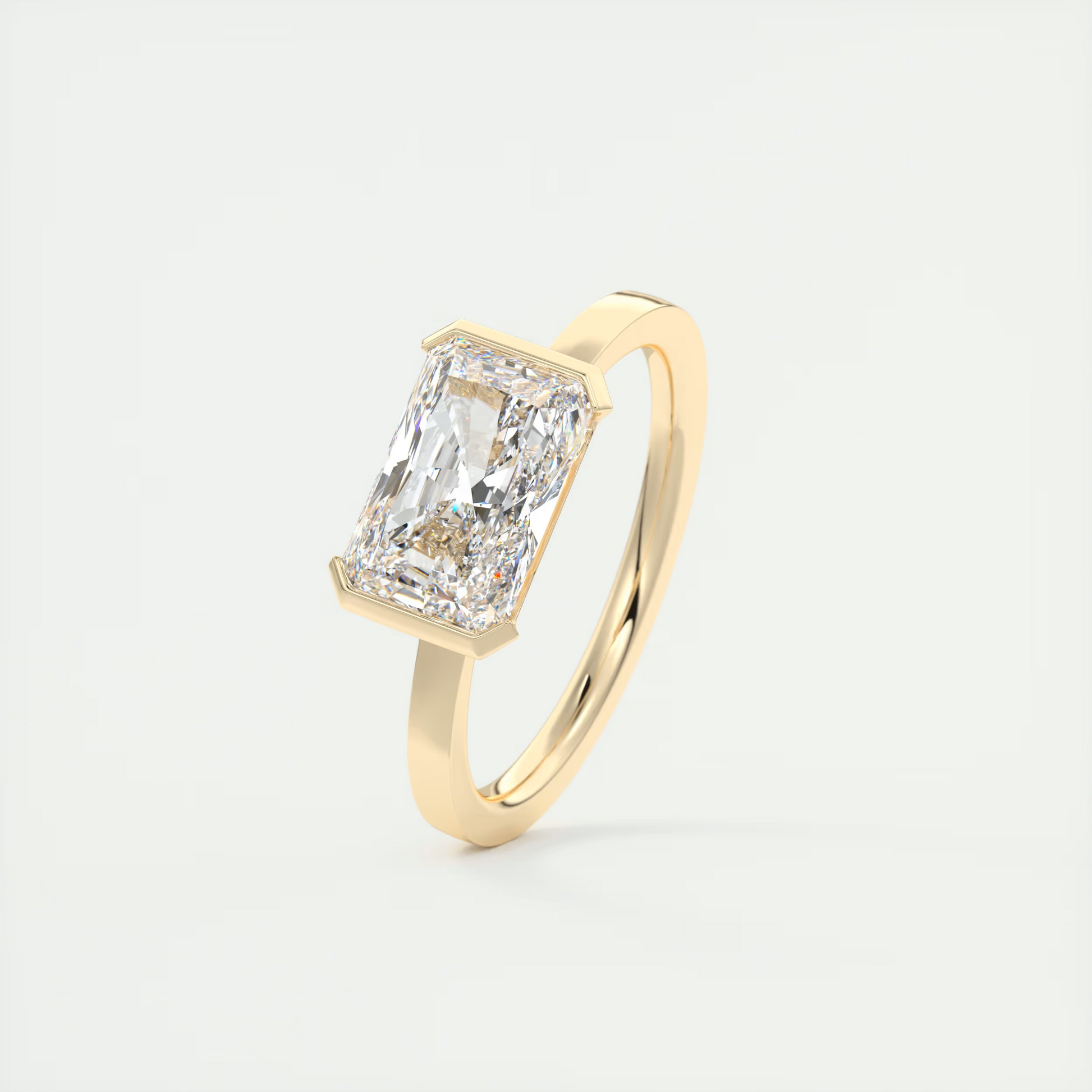 2 Carat East West Radiant Emerald Half Bezel Solitaire