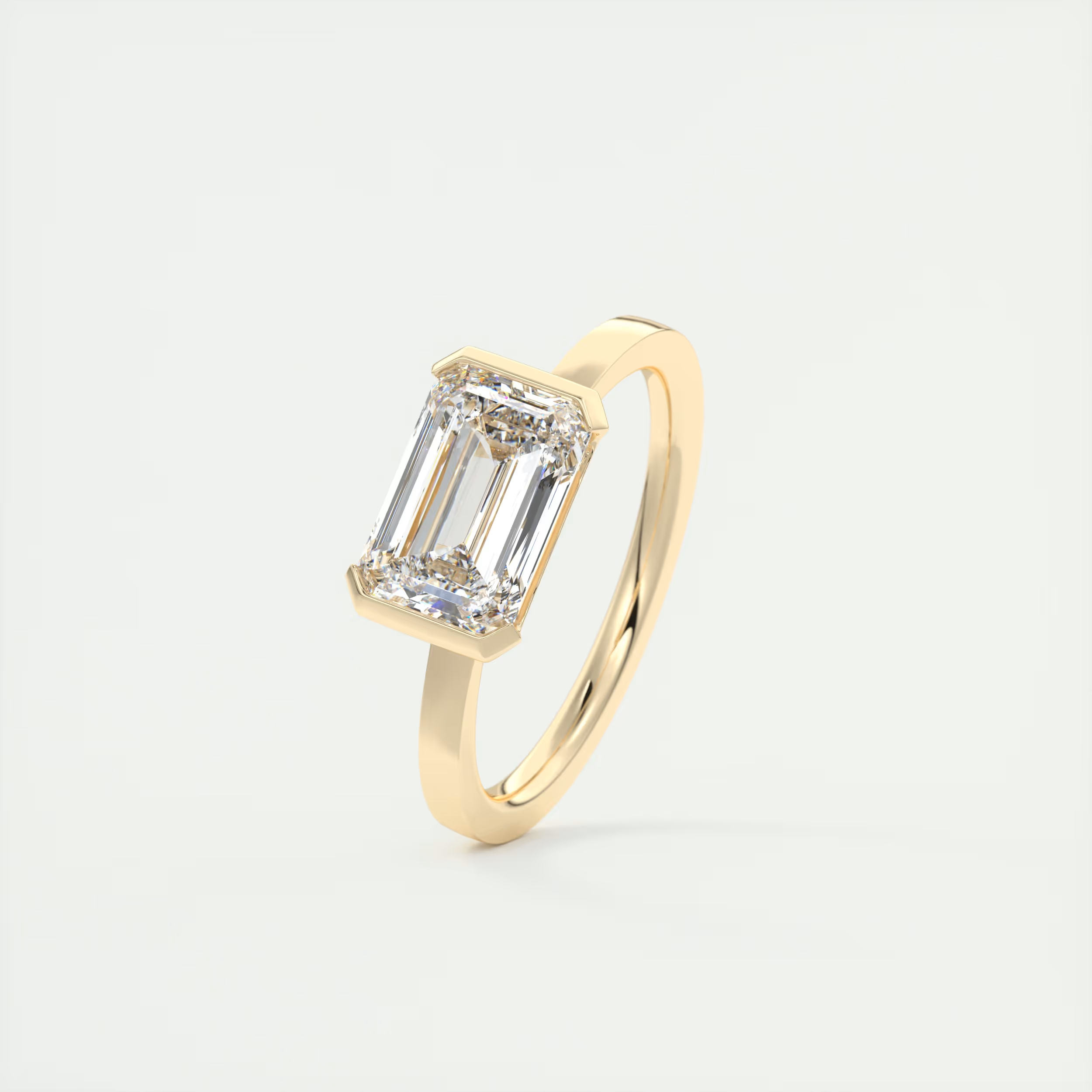 2 Carat East West Emerald Half Bezel Solitaire