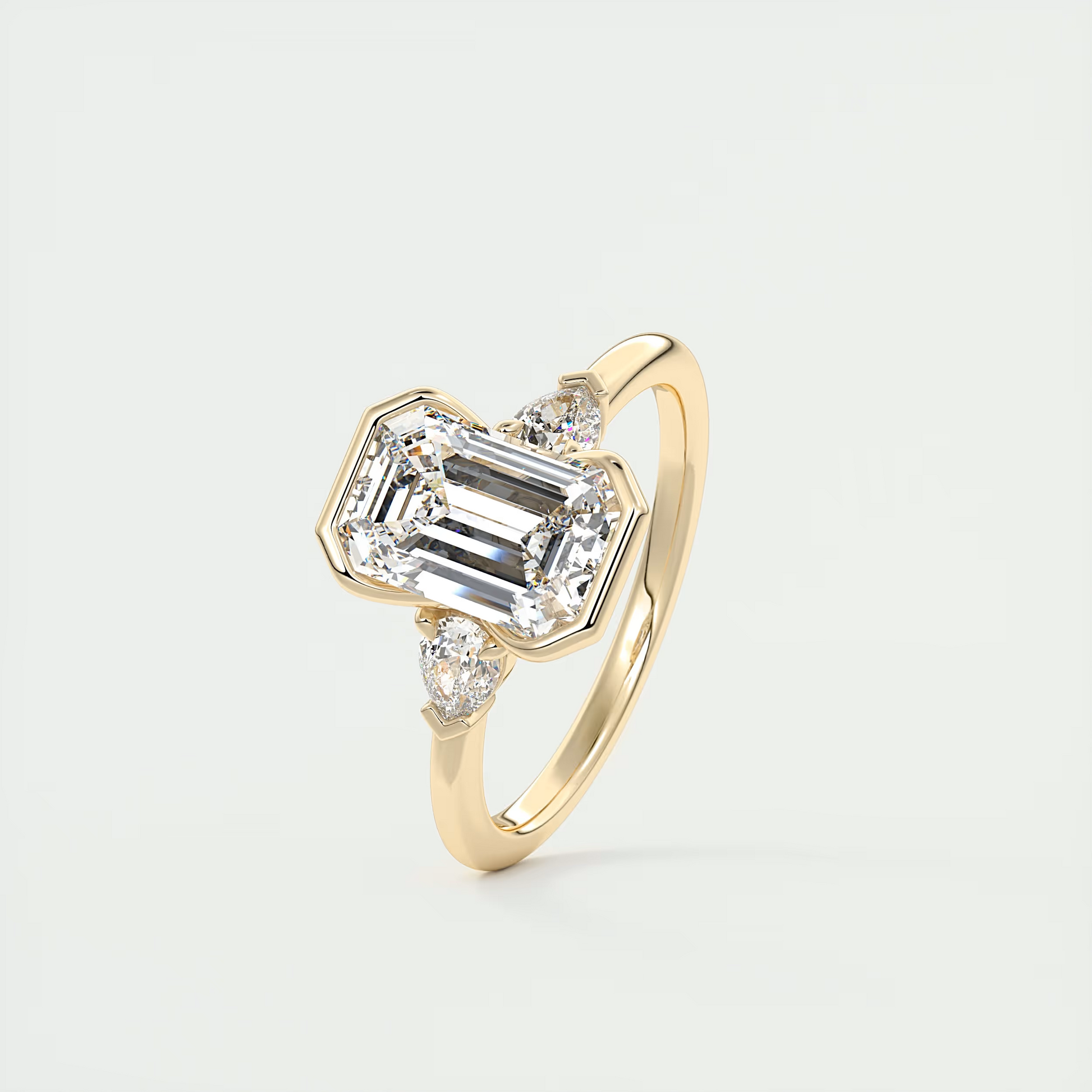 2 Carat Emerald & Pear Clutch Three-Stone Engagement Ring