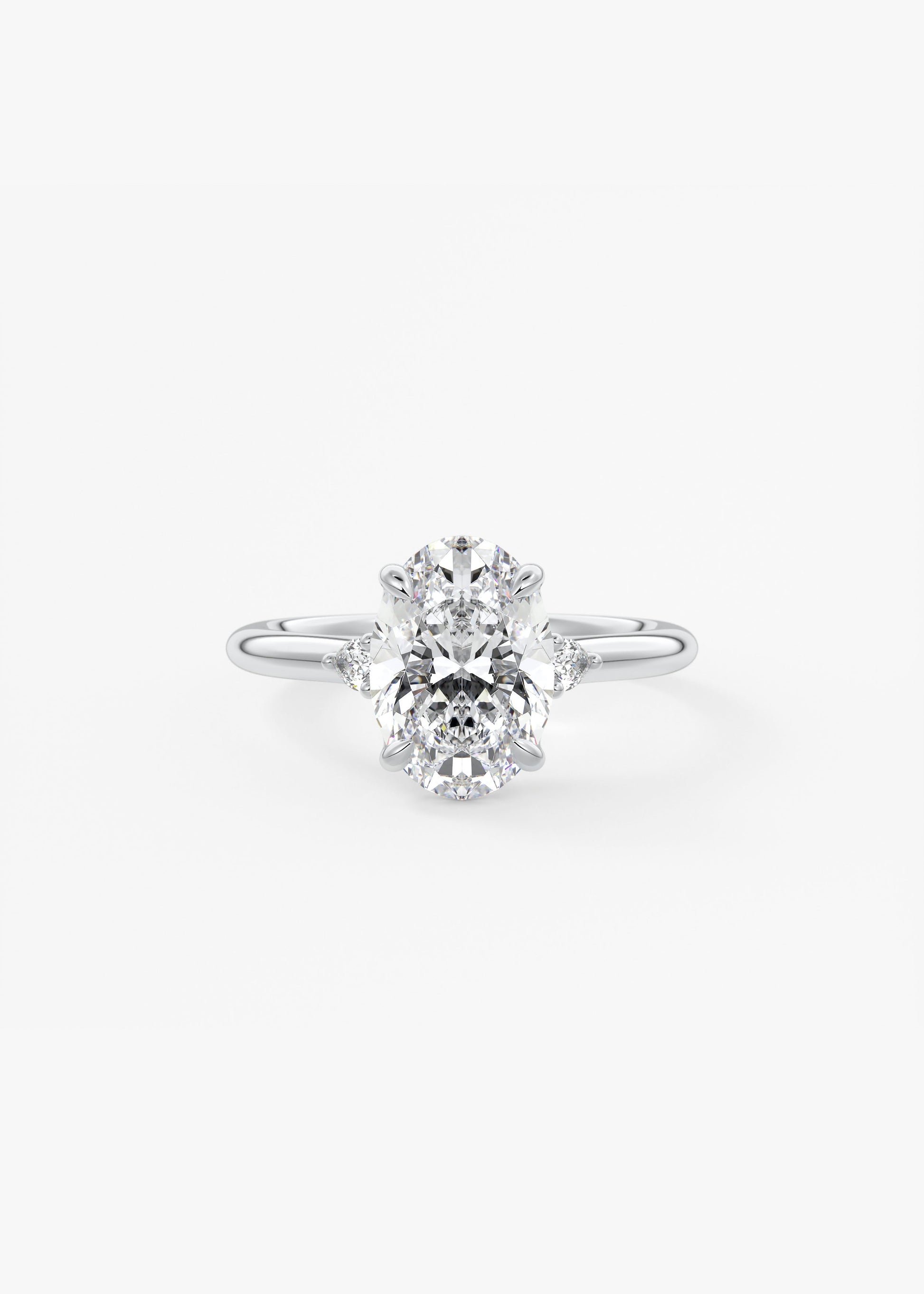 Soft Curves 2 Carat Oval Three-Stone Trellis Engagement Ring