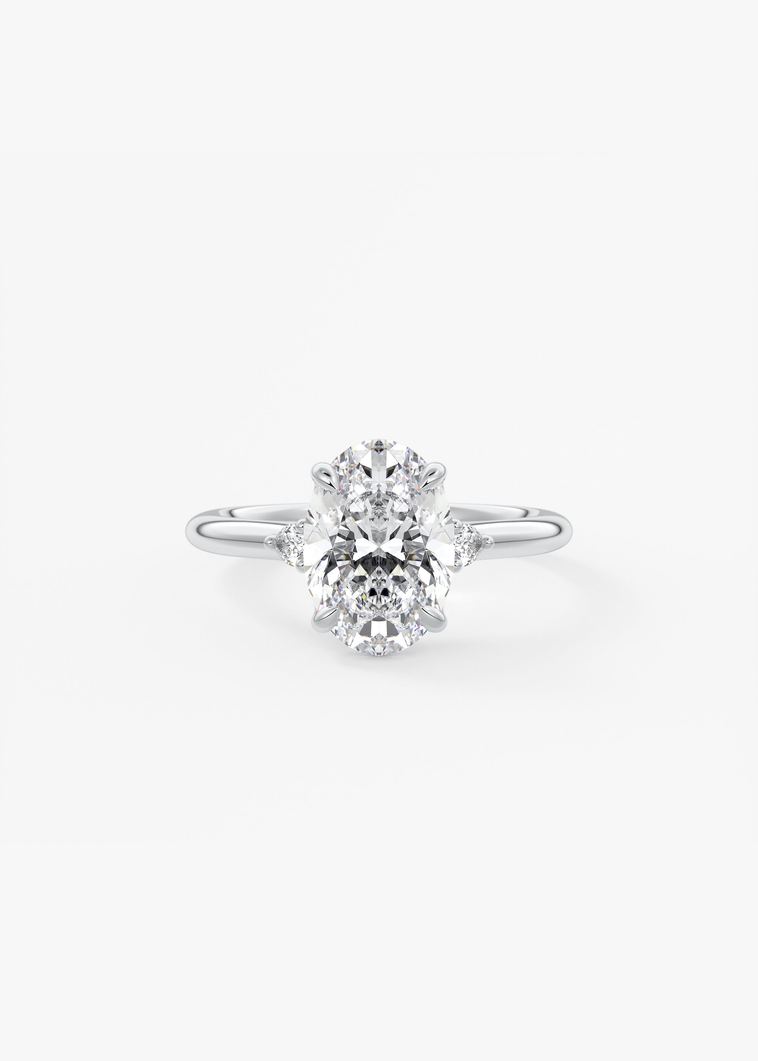 Soft Curves 2 Carat Oval Three-Stone Trellis Engagement Ring