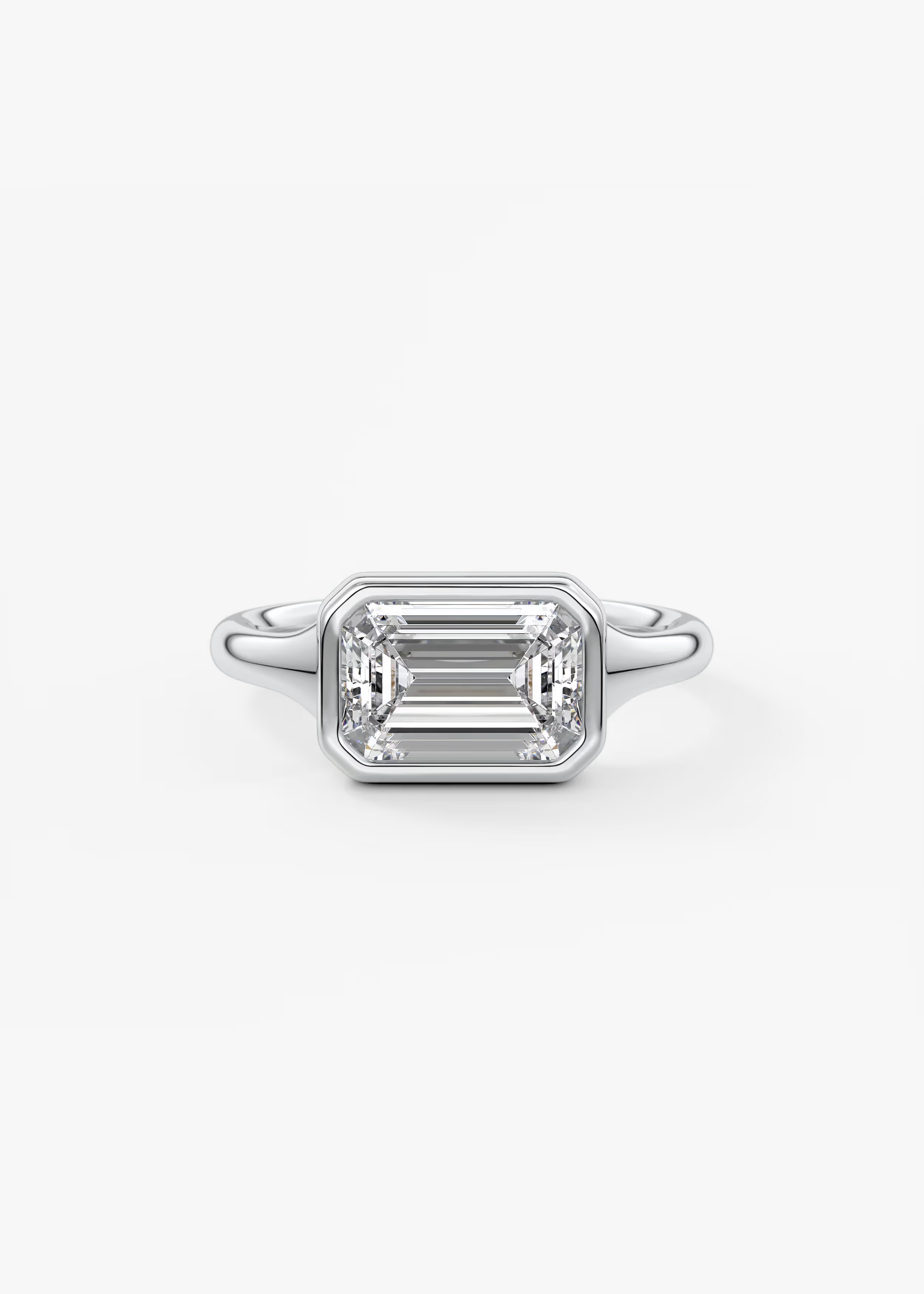 East-West 2 Carat Emerald Bezel Solitaire Ring