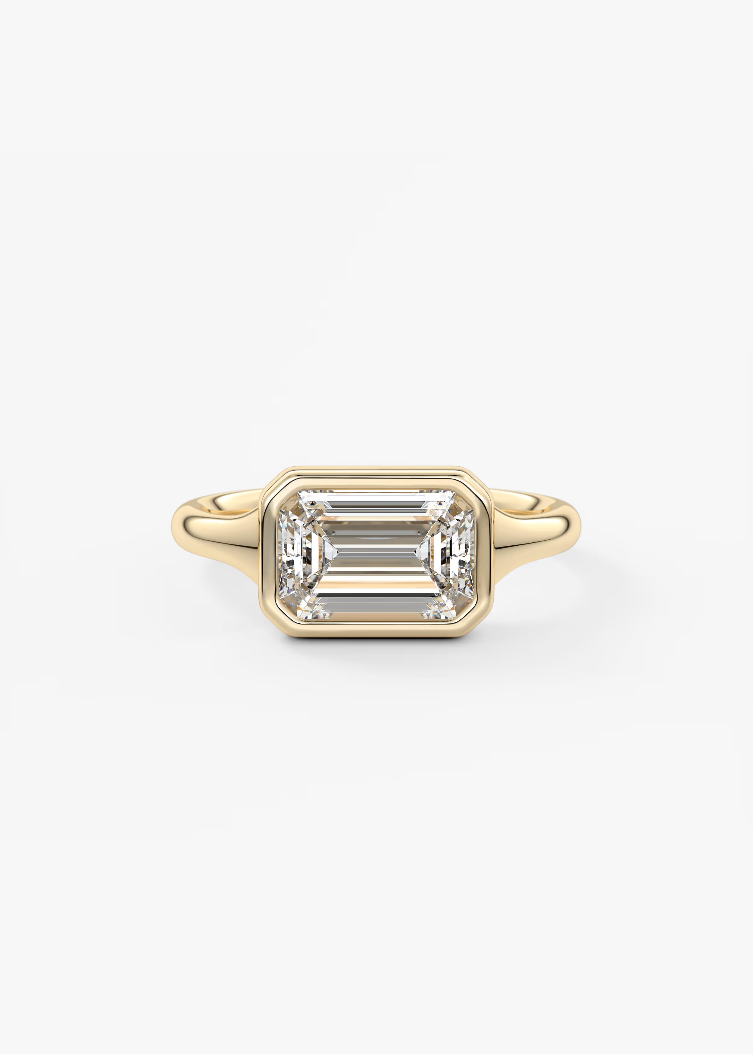 East-West 2 Carat Emerald Bezel Solitaire Ring