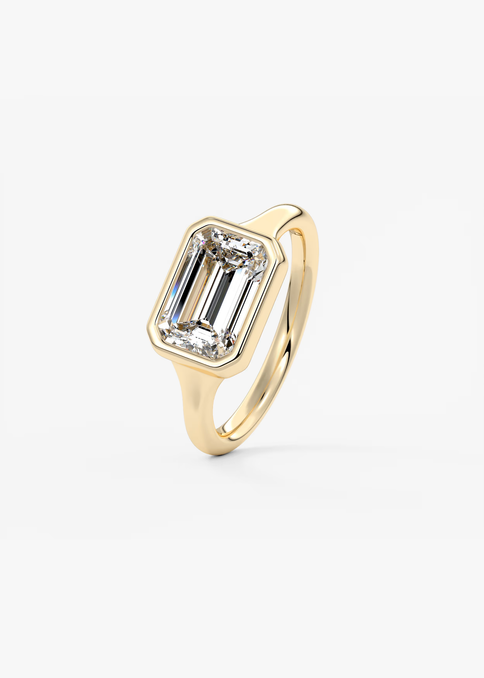 East-West 2 Carat Emerald Bezel Solitaire Ring