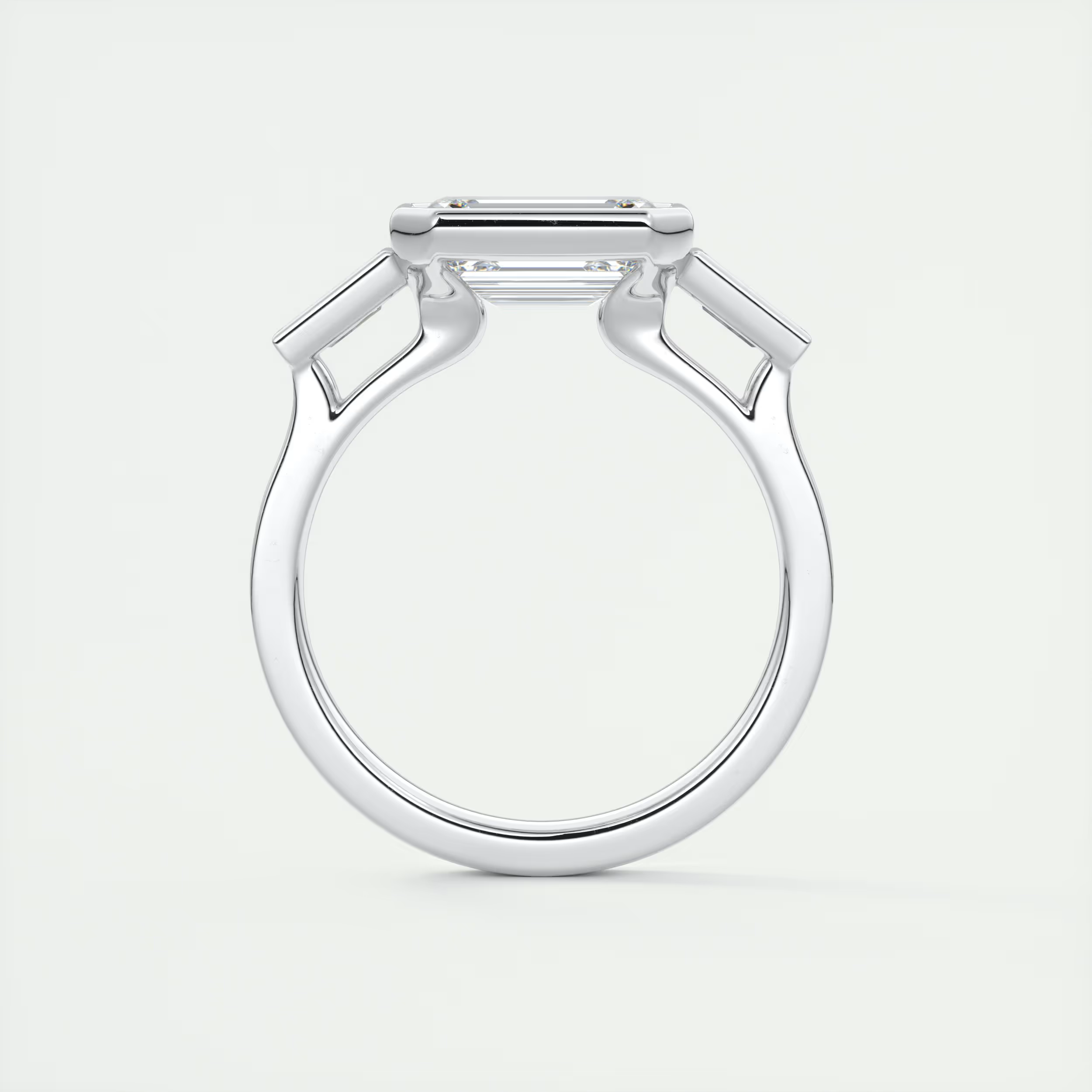 Elevated 2 Carat Emerald & Tapered Baguette Three-Stone Bezel Set Engagement Ring