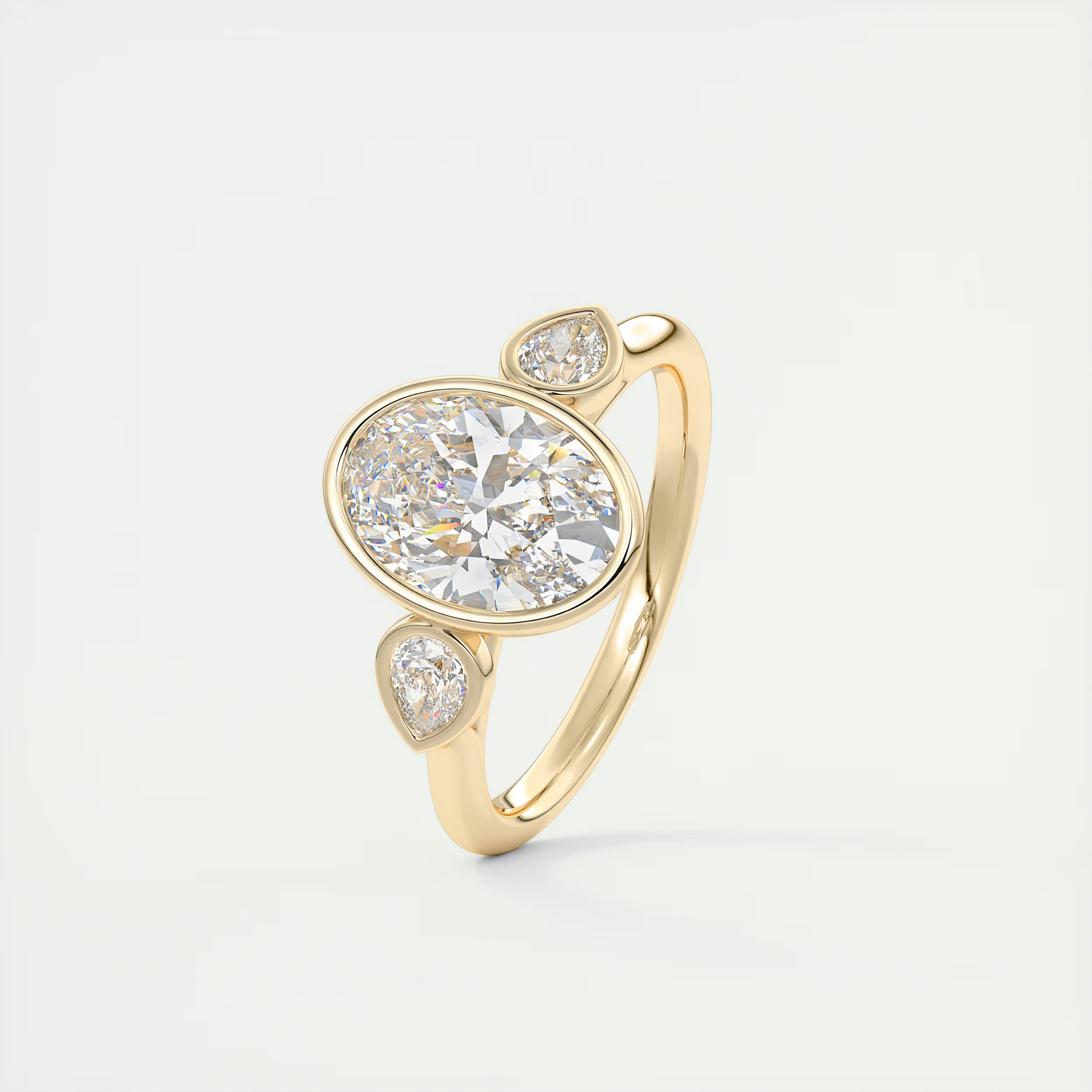 Bold 2 Carat Oval & Pear Three-Stone Bezel Set Engagement Ring