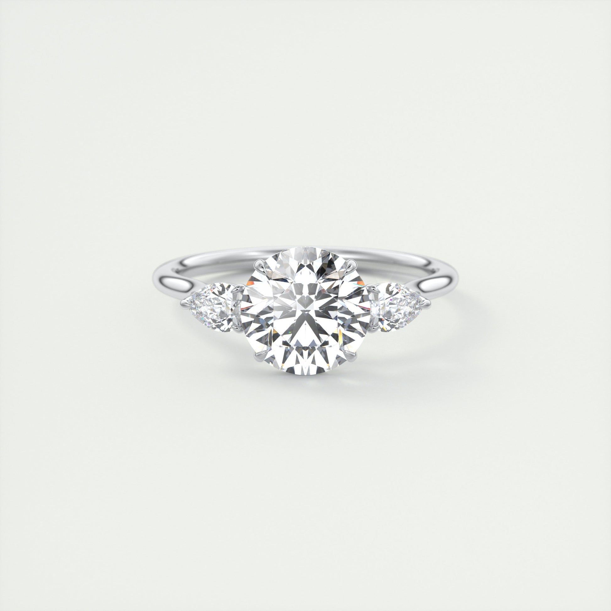 Soft Curves 1.5 Carat Round Flush Stacking Pear Three-Stone Engagement Ring