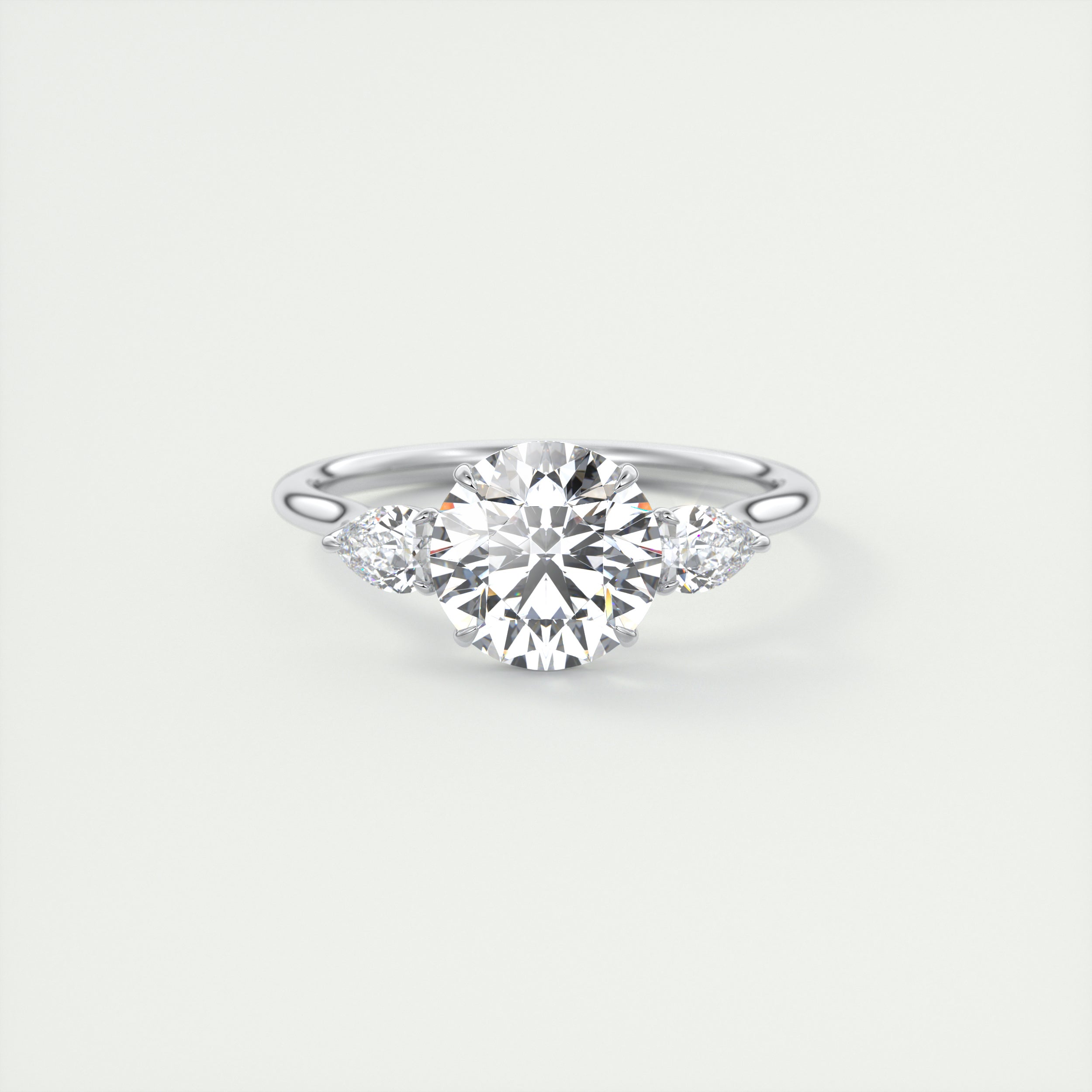 Soft Curves 1.5 Carat Round Flush Stacking Pear Three-Stone Engagement Ring