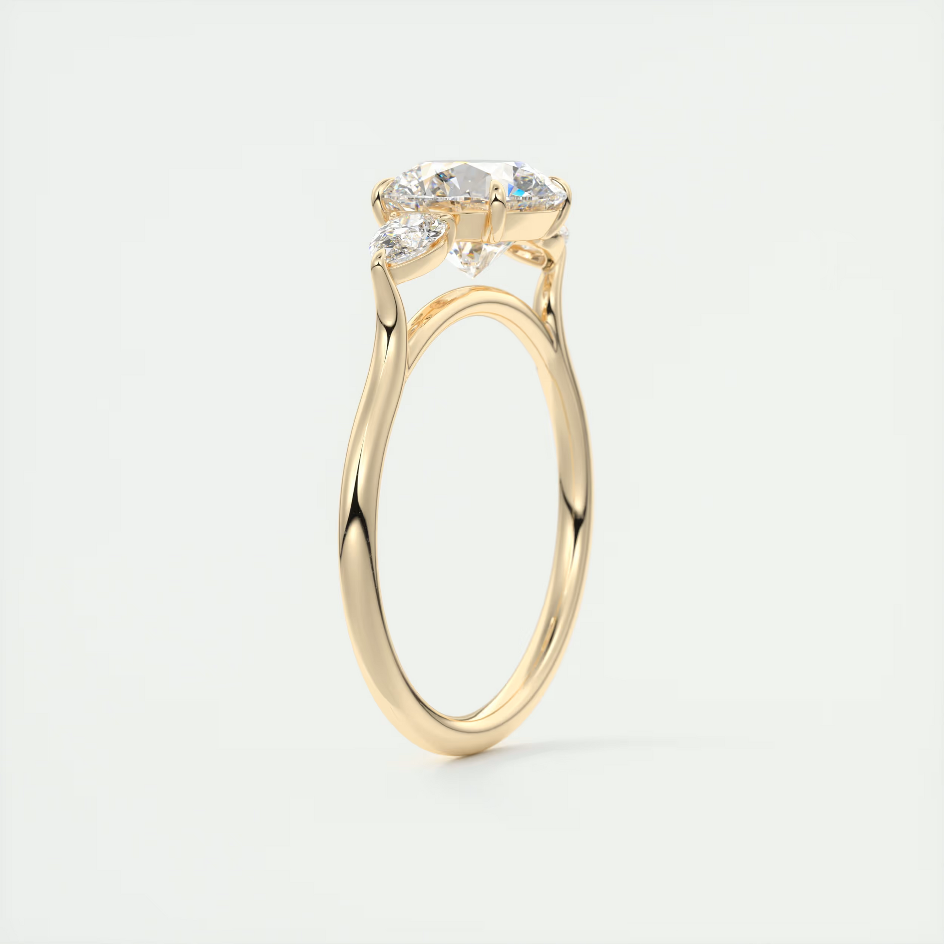 Soft Curves 1.5 Carat Round Flush Stacking Pear Three-Stone Engagement Ring