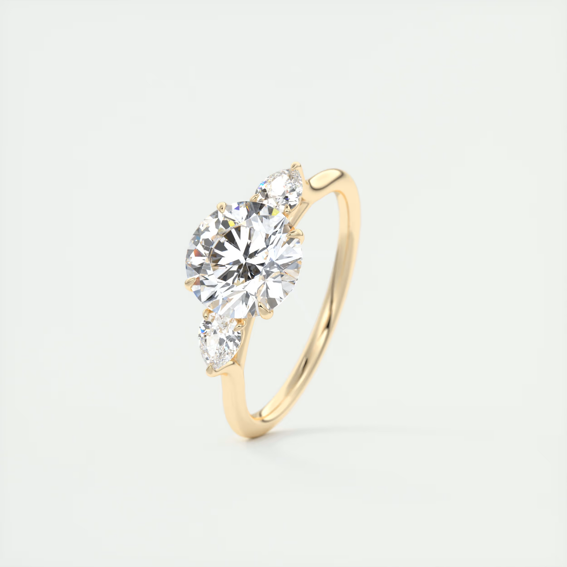 Soft Curves 1.5 Carat Round Flush Stacking Pear Three-Stone Engagement Ring