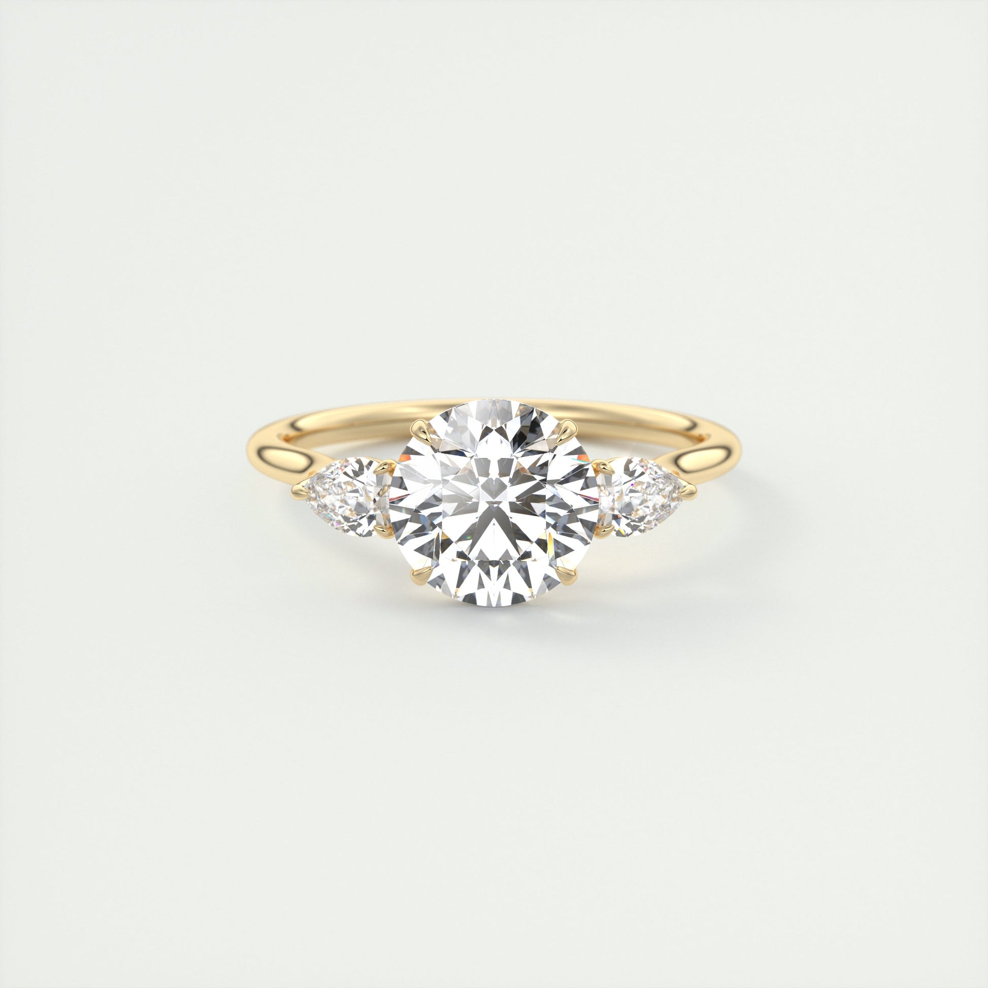 Soft Curves 1.5 Carat Round Flush Stacking Pear Three-Stone Engagement Ring